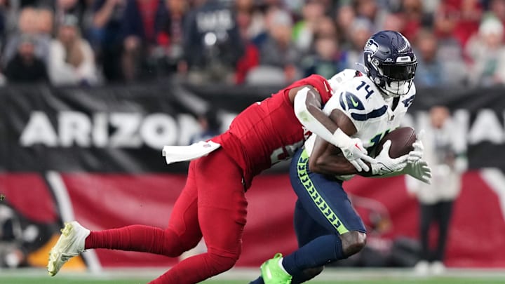 Jan 7, 2024; Glendale, Arizona, USA; Seattle Seahawks wide receiver DK Metcalf (14) runs after making a catch against the Arizona Cardinals during the first half at State Farm Stadium. Mandatory Credit: Joe Camporeale-Imagn Images