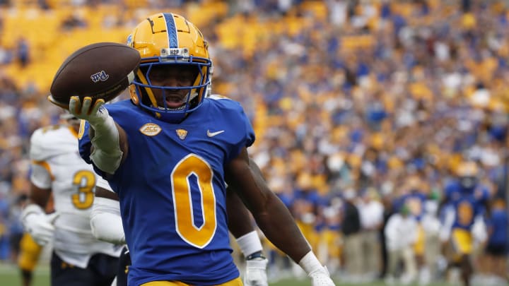 Aug 31, 2024; Pittsburgh, Pennsylvania, USA;  Pittsburgh Panthers running back Desmond Reid (0) runs on his way to scoring a touchdown against the Kent State Golden Flashes during the third quarter at Acrisure Stadium. Pittsburgh won 55-24. Mandatory Credit: Charles LeClaire-USA TODAY Sports