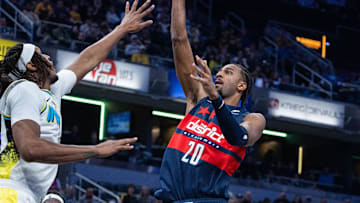 Nov 24, 2024; Indianapolis, Indiana, USA; Washington Wizards forward Alexandre Sarr (20) shoots the ball while Indiana Pacers center Myles Turner (33) defends in the second half at Gainbridge Fieldhouse. Mandatory Credit: Trevor Ruszkowski-Imagn Images