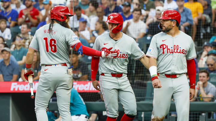 Aug 3, 2024; Seattle, Washington, USA; Philadelphia Phillies center fielder Brandon Marsh greets designated hitter Kyle Schwarber and left fielder Austin Hays.