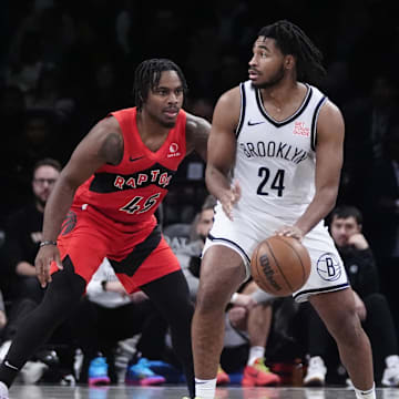 Oct 18, 2024; Brooklyn, New York, USA; Brooklyn Nets small guard Cam Thomas (24) dribbles the ball against Toronto Raptors forward Bruno Fernando (24) during the second half at Barclays Center. Mandatory Credit: Gregory Fisher-Imagn Images