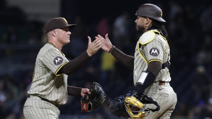 Aug 7, 2024; Pittsburgh, Pennsylvania, USA;  San Diego Padres relief pitcher Adrian Morejon (50) and catcher Luis Campusano (12) shake hands after defeating the Pittsburgh Pirates at PNC Park. San Diego won 9-8 in ten innings. Mandatory Credit: Charles LeClaire-USA TODAY Sports