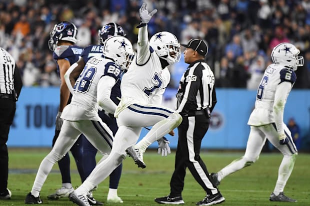 Dallas Cowboys cornerback Trevon Diggs celebrates after a fumble was recovered by linebacker Micah Parsons