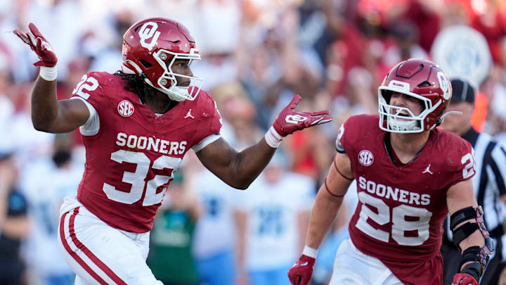 Oklahoma Sooners defensive lineman R Mason Thomas (32) celebrates beside Oklahoma Sooners linebacker Danny Stutsman (28) after a sacks during a college football game between the University of Oklahoma Sooners (OU) and the Tulane Green Wave at Gaylord Family - Oklahoma Memorial Stadium in Norman, Okla., Saturday, Sept. 14, 2024.