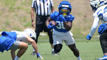 May 28, 2024; Thousand Oaks, CA, USA; Los Angeles Rams Boston Scott (30) runs the ball during OTAs at the team training facility at California Lutheran University. Mandatory Credit: Jayne Kamin-Oncea-USA TODAY Sports