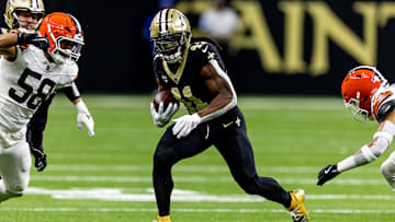 Nov 17, 2024; New Orleans, Louisiana, USA;  New Orleans Saints running back Alvin Kamara (41) rushes against Cleveland Browns linebacker Jordan Hicks (58) during the first half at Caesars Superdome. Mandatory Credit: Stephen Lew-Imagn Images