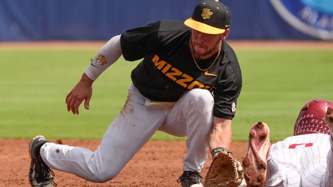 May 20, 2025; Hoover, AL, USA; Missouri second baseman Keegan Knutson tags out Alabama outfielder Bryce Fowler (9) as he attempts a steal in the first game of the SEC Baseball Tournament at the Hoover Met.