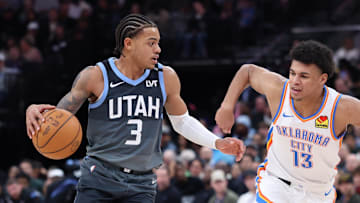 Dec 7, 2025; Salt Lake City, Utah, USA; Utah Jazz guard Keyonte George (3) moves the ball as Oklahoma City Thunder forward Ousmane Dieng (13) defends during the second half at Delta Center. Mandatory Credit: Rob Gray-Imagn Images