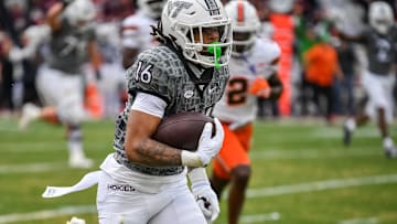 Nov 22, 2025; Blacksburg, Va.; Virginia Tech running back Jeffrey Overton (16) runs the ball for a touchdown during the third quarter at Lane Stadium.