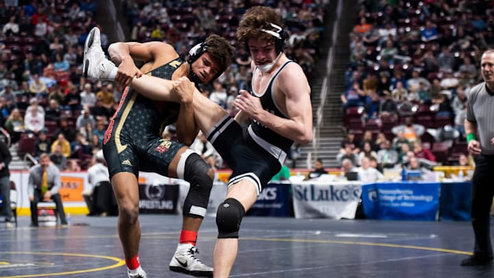 Bishop McCort's Melvin Miller takes down Faith Christians' Max Stein with six seconds left in the third period to claim gold at 152 pounds at the PIAA Class 2A Wrestling Championships at the Giant Center on March 9, 2024, in Hershey.