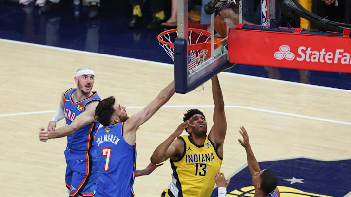 Jun 19, 2025; Indianapolis, Indiana, USA; Indiana Pacers center Tony Bradley (13) shoots the ball against Oklahoma City Thunder guard Alex Caruso (9), forward Chet Holmgren (7) and guard Aaron Wiggins (21) in the second quarter during game six of the 2025 NBA Finals at Gainbridge Fieldhouse. Jun 19, 2025; Indianapolis, Indiana, USA; Indiana Pacers center Tony Bradley (13) shoots the ball against Oklahoma City Thunder guard Alex Caruso (9), forward Chet Holmgren (7) and guard Aaron Wiggins (21) in the second quarter during game six of the 2025 NBA Finals at Gainbridge Fieldhouse.