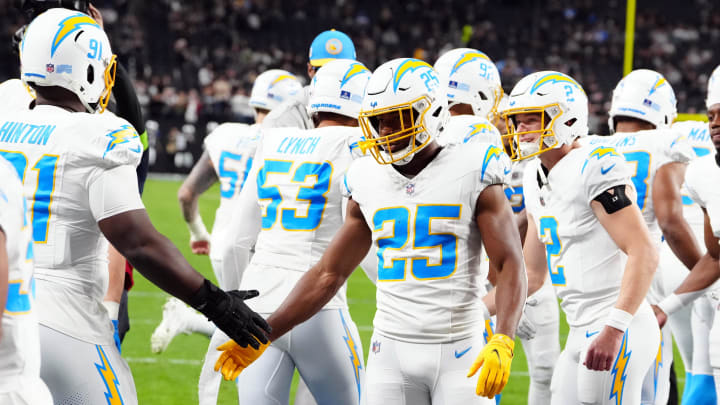 Dec 14, 2023; Paradise, Nevada, USA;  Los Angeles Chargers running back Joshua Kelley (25) warms up before the game against the Las Vegas Raiders at Allegiant Stadium. Mandatory Credit: Stephen R. Sylvanie-USA TODAY Sports