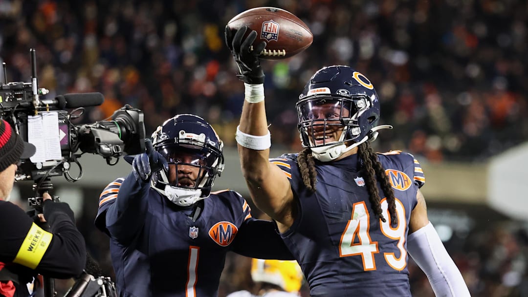 Dec 20, 2025; Chicago, Illinois, USA; Chicago Bears linebacker Tremaine Edmunds (49) poses for a television camera with cornerback Jaylon Johnson (1) after recovering a fumble against the Green Bay Packers during the third quarter at Soldier Field. Mandatory Credit: Mike Dinovo-Imagn Images