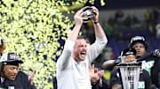 Oregon Ducks head coach Dan Lanning and the Oregon Ducks celebrate defeating the Penn State Nittany Lions to win the Big Ten Championship in the 2024 Big Ten Championship game at Lucas Oil Stadium.