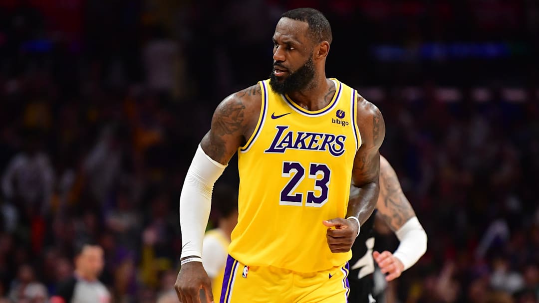 Feb 28, 2024; Los Angeles, California, USA; Los Angeles Lakers forward LeBron James (23) reacts after scoring three point basket against the Los Angeles Clippers during the second half at Crypto.com Arena. Mandatory Credit: Gary A. Vasquez-Imagn Images