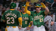 Aug 25, 2025; West Sacramento, California, USA; Athletics catcher Shea Langeliers (23) celebrates with third baseman Brett Harris (11) and outfielder Tyler Soderstrom (21) after hitting a grand slam against the Detroit Tigers during the seventh inning at Sutter Health Park. Mandatory Credit: Ed Szczepanski-Imagn Images