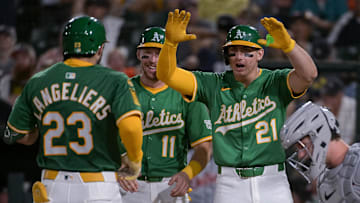 Aug 25, 2025; West Sacramento, California, USA; Athletics catcher Shea Langeliers (23) celebrates with third baseman Brett Harris (11) and outfielder Tyler Soderstrom (21) after hitting a grand slam against the Detroit Tigers during the seventh inning at Sutter Health Park. Mandatory Credit: Ed Szczepanski-Imagn Images
