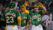 Aug 25, 2025; West Sacramento, California, USA; Athletics catcher Shea Langeliers (23) celebrates with third baseman Brett Harris (11) and outfielder Tyler Soderstrom (21) after hitting a grand slam against the Detroit Tigers during the seventh inning at Sutter Health Park. Mandatory Credit: Ed Szczepanski-Imagn Images