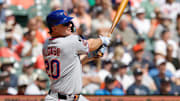 Sep 3, 2025; Detroit, Michigan, USA;  New York Mets player Pete Alonso (20) hits an RBI double in the third inning against the Detroit Tigers at Comerica Park. Mandatory Credit: Rick Osentoski-Imagn Images