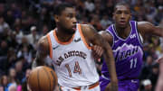 Feb 25, 2024; Salt Lake City, Utah, USA; San Antonio Spurs guard Blake Wesley (14) dribbles past Utah Jazz guard Kris Dunn (11) during the third quarter at Delta Center. 