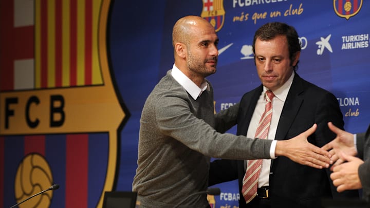 Barcelona's coach Josep Guardiola (L) an