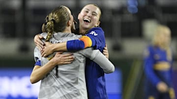 Utah Royals FC goalkeeper Mandy Haught (1) hugs defender Kate Del Fava (8) during the second half at Providence Park 