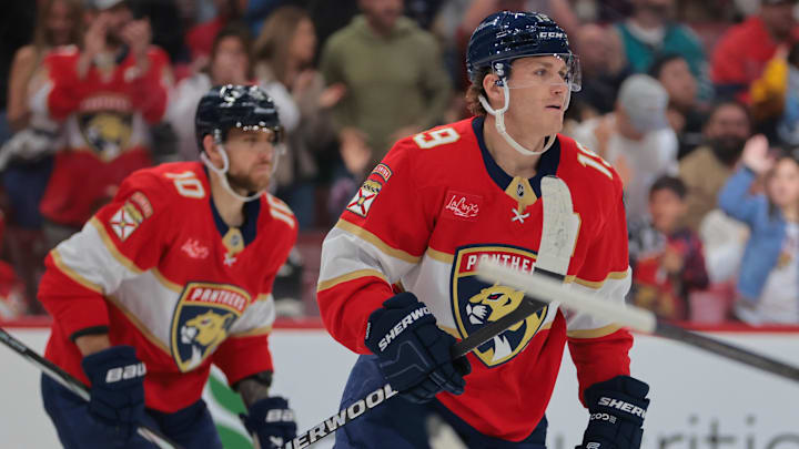 Dec 7, 2024; Sunrise, Florida, USA; Florida Panthers left wing Matthew Tkachuk (19) looks on after scoring against the San Jose Sharks during the second period at Amerant Bank Arena. Mandatory Credit: Sam Navarro-Imagn Images Dec 7, 2024; Sunrise, Florida, USA; Florida Panthers left wing Matthew Tkachuk (19) looks on after scoring against the San Jose Sharks during the second period at Amerant Bank Arena. Mandatory Credit: Sam Navarro-Imagn Images