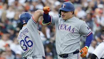 May 10, 2025; Detroit, Michigan, USA;  Texas Rangers designated hitter Joc Pederson (4) receives congratulations from left fielder Wyatt Langford (36) after he hits a two run home run in the third inning against the Detroit Tigers at Comerica Park.