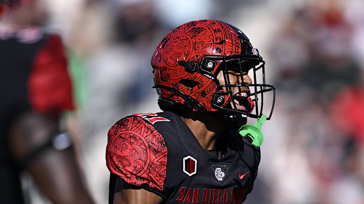 Aug 26, 2023; San Diego, California, USA; San Diego State Aztecs cornerback Chris Johnson (21) celebrates after a stop against the Ohio Bobcats during the first half at Snapdragon Stadium. Mandatory Credit: Orlando Ramirez-Imagn Images