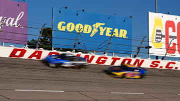 Sep 1, 2024; Darlington, South Carolina, USA; NASCAR Cup Series driver Bubba Wallace (23)  leads his teammate NASCAR Cup Series driver Tyler Reddick (45) during the Cook Out Southern 500 at Darlington Raceway. 