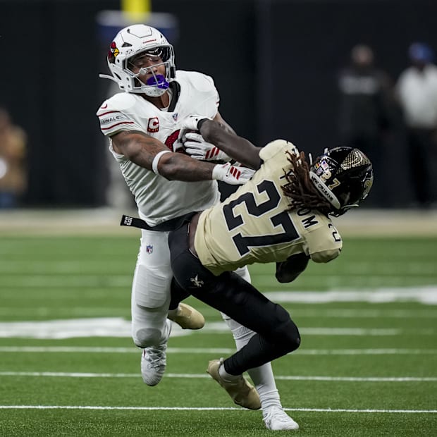 Arizona Cardinals running back James Conner (6) sheds the tackle of New Orleans Saints cornerback Isaac Yiadom.