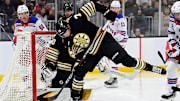 Sep 24, 2023; Boston, Massachusetts, USA; Boston Bruins defenseman Alec Regula (75)  makes the save against against the New York Rangers during the second period at TD Garden. Mandatory Credit: Eric Canha-Imagn Images