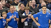 Dallas Mavericks minority owner Mark Cuban celebrates with his son Jake Cuban during a game against the Boston Celtics.