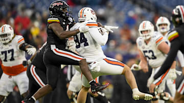 Dec 30, 2023; Nashville, TN, USA; Auburn Tigers tight end Micah Riley (84) makes a catch as Maryland Terrapins defensive back Tarheeb Still (4) defends during the second half at Nissan Stadium. Mandatory Credit: Steve Roberts-USA TODAY Sports