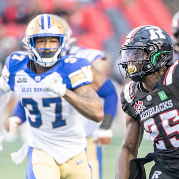 Jun 13, 2024; Ottawa, Ontario, CAN; Ottawa REDBLACKS running back Ryquell Armstead (25) runs the ball in the first half against the Winnipeg Blue Bombers at TD Place. Mandatory Credit: Marc DesRosiers-Imagn Images