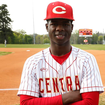 Clarke Central's Rio Foster poses for a photo with his super fan mom Iris Cleveland before a high school baseball game.