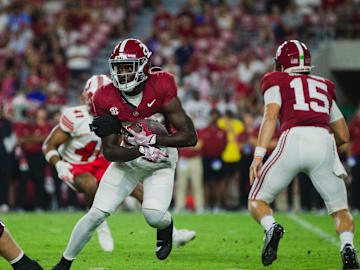 Aug 31, 2024; Tuscaloosa, Alabama, USA;  Alabama Crimson Tide running back Kevin Riley (28) carries the ball against the Western Kentucky Hilltoppers during the fourth quarter at Bryant-Denny Stadium. 