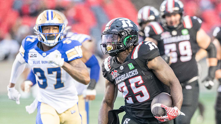 Jun 13, 2024; Ottawa, Ontario, CAN; Ottawa REDBLACKS running back Ryquell Armstead (25) runs the ball in the first half against the Winnipeg Blue Bombers at TD Place. Mandatory Credit: Marc DesRosiers-Imagn Images