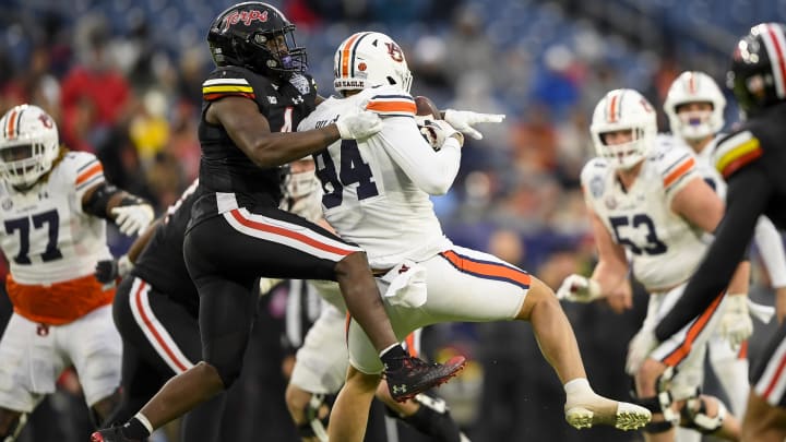 Dec 30, 2023; Nashville, TN, USA; Auburn Tigers tight end Micah Riley (84) makes a catch as Maryland Terrapins defensive back Tarheeb Still (4) defends during the second half at Nissan Stadium. Mandatory Credit: Steve Roberts-USA TODAY Sports