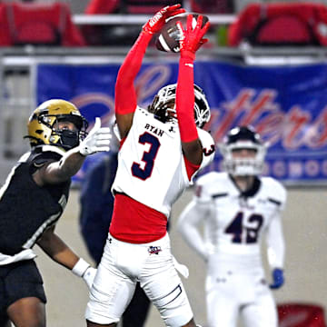 Ryan's Tyrese Weaver deflects a pass meant for Abilene's Ryland Bradford in a 5A Division I playoff game on Nov. 17, 2023.