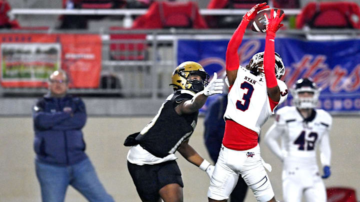 Ryan's Tyrese Weaver deflects a pass meant for Abilene's Ryland Bradford in a 5A Division I playoff game on Nov. 17, 2023.