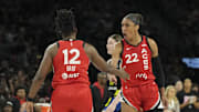 Aug 17, 2025; Las Vegas, Nevada, USA; Las Vegas Aces center A'ja Wilson (22) celebrates with guard Chelsea Gray (12) against the Dallas Wings in the second quarter at Michelob Ultra Arena. Mandatory Credit: Candice Ward-Imagn Images