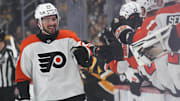 Philadelphia Flyers left wing Noah Cates celebrates with teammates after scoring a goal against the Pittsburgh Penguins.