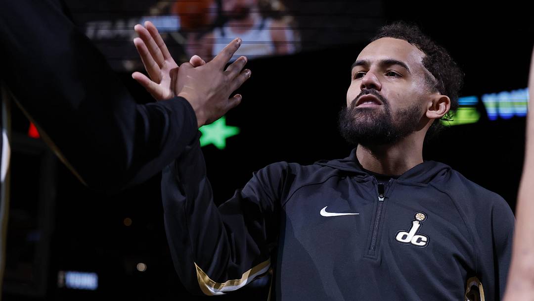 Mar 5, 2026; Washington, District of Columbia, USA; Washington Wizards guard Trae Young (3) shakes hands with teammates during player introductions for his first start as a Wizard against the Utah Jazz at Capital One Arena. Mandatory Credit: Geoff Burke-Imagn Images