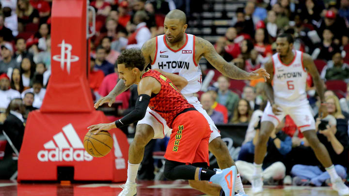 Nov 30, 2019; Houston, TX, USA; Atlanta Hawks guard Trae Young (11) handles the ball while Houston Rockets forward PJ Tucker (17) defends during the game at Toyota Center. Mandatory Credit: Erik Williams-USA TODAY Sports