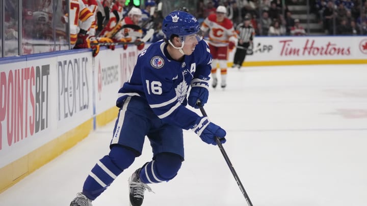 Nov 10, 2023; Toronto, Ontario, CAN; Toronto Maple Leafs forward Mitchell Marner (16) carries the puck against the Calgary Flames during the first period at Scotiabank Arena. Mandatory Credit: John E. Sokolowski-USA TODAY Sports