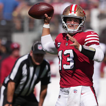 Oct 6, 2024; Santa Clara, California, USA; San Francisco 49ers quarterback Brock Purdy (13) throws a pass against the Arizona Cardinals during the first quarter at Levi's Stadium. Mandatory Credit: Darren Yamashita-Imagn Images