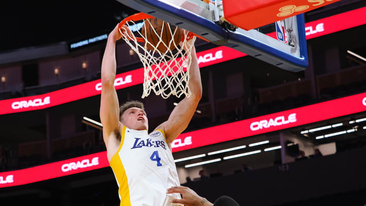 Jul 10, 2024; San Francisco, CA, USA; Los Angeles Lakers guard Dalton Knecht (4) dunks the ball against the Miami Heat during the third quarter at Chase Center. Mandatory Credit: Kelley L Cox-USA TODAY Sports