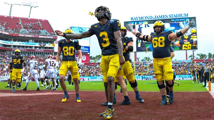 Dec 31, 2024; Tampa, FL, USA; Michigan Wolverines wide receiver Fredrick Moore (3) celebrates after scoring  a touchdown against the Alabama Crimson Tide in the first quarter during the ReliaQuest Bowl at Raymond James Stadium. Mandatory Credit: Nathan Ray Seebeck-Imagn Images