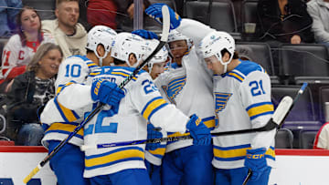Oct 25, 2025; Detroit, Michigan, USA;  St. Louis Blues right wing Jordan Kyrou (25) receives congratulations from teammates after scoring in the first period against the Detroit Red Wings at Little Caesars Arena. Mandatory Credit: Rick Osentoski-Imagn Images